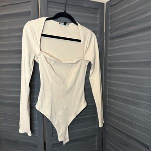 Long sleeve low cut body suit